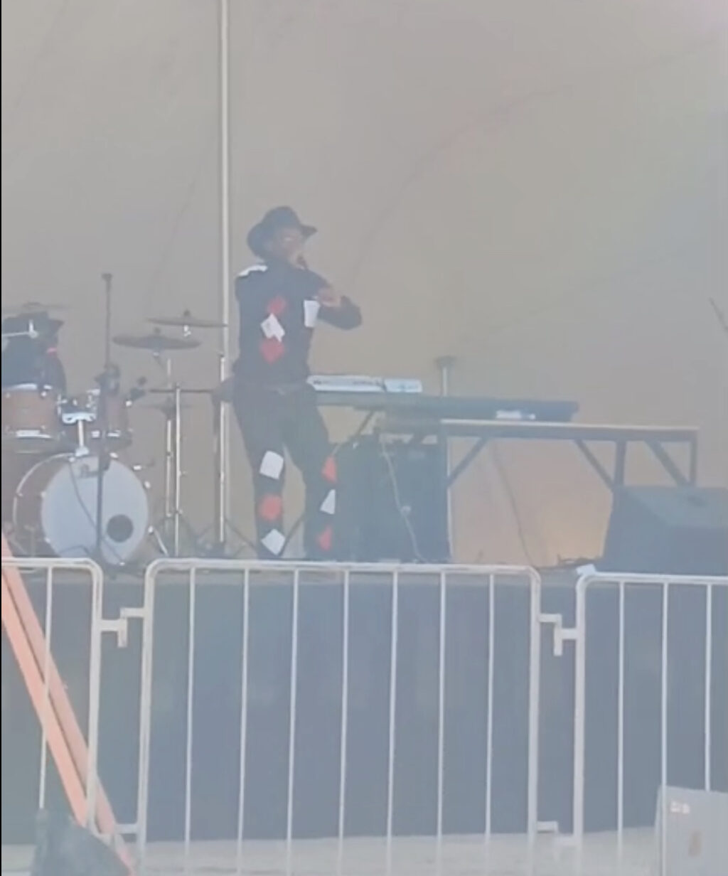 Image of Mr. Boetles Gewers performing on a stage. 