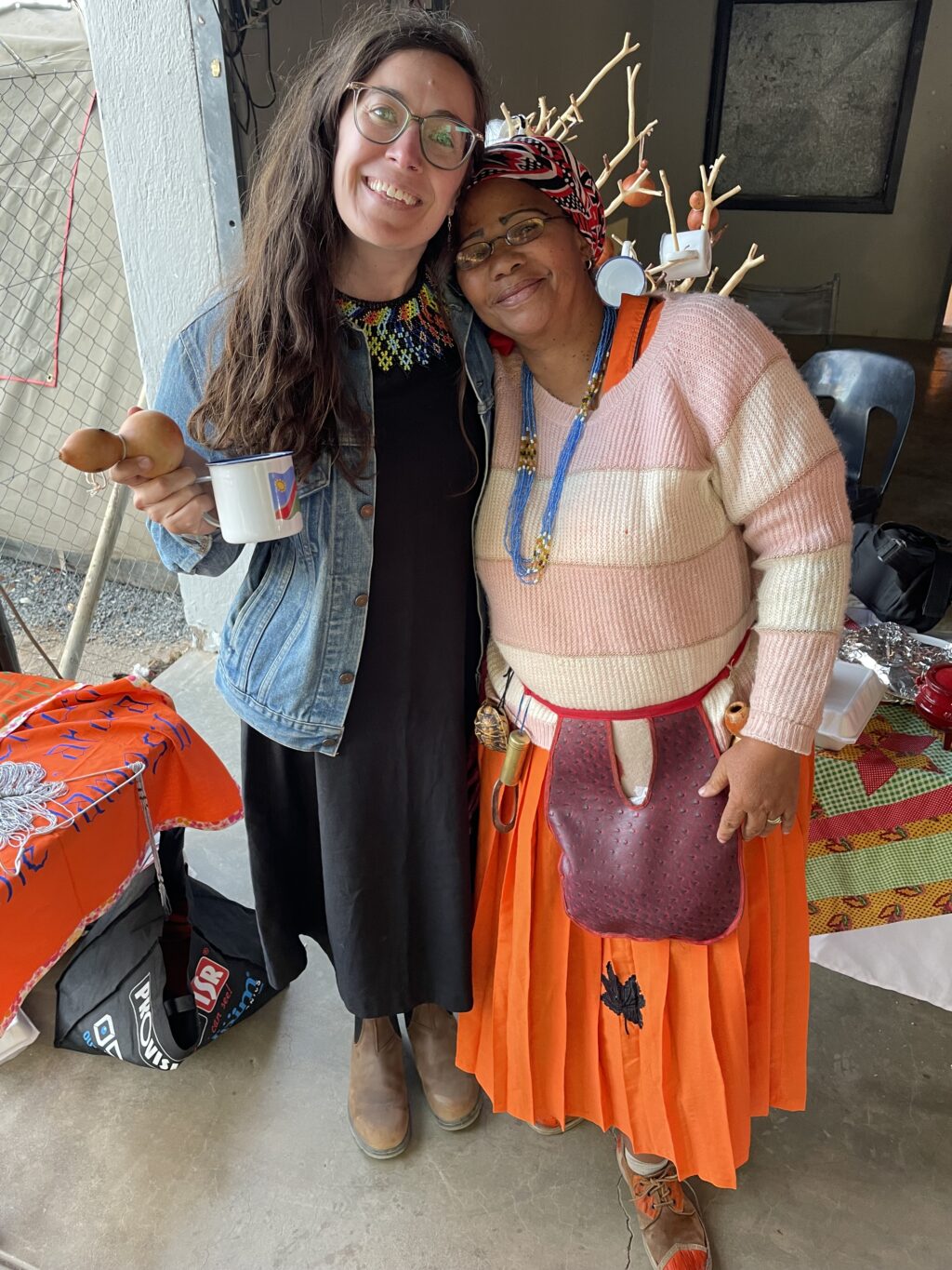 Lyndsey Copeland posing with Rose Kuhanga, a vendor of Nama crafts.