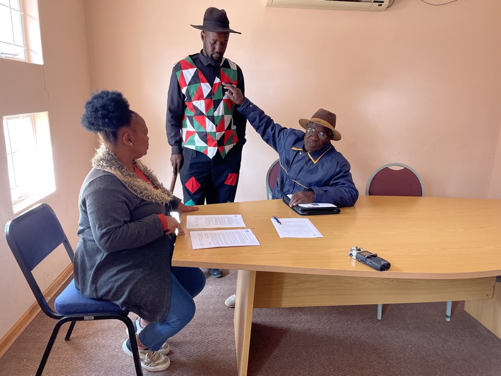 Abraham Katimba gestures at the Riemvasmaak Choir uniform.