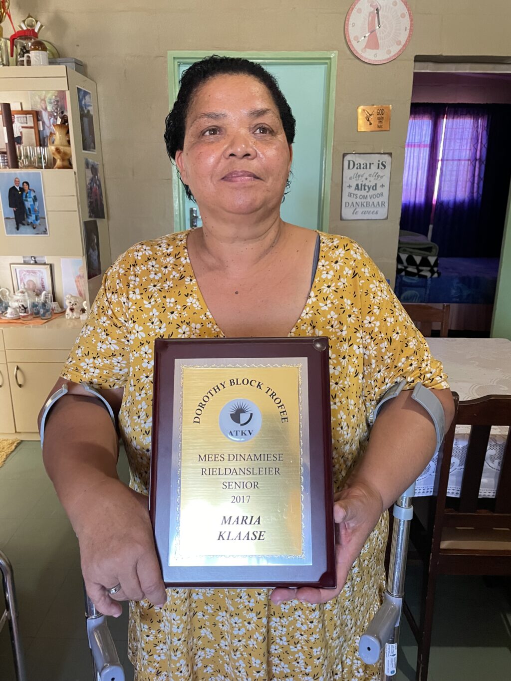 Ms Klaase poses with a trophy.