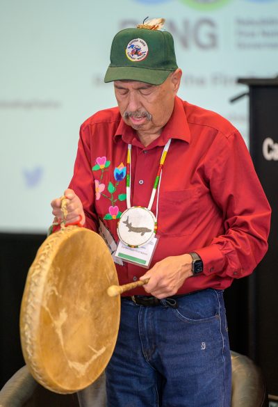 Elder Darrell Boissoneau holding a drum