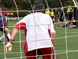 Image of 2023 Stoney Cup: Close up of game from behind goal with player and ball approaching