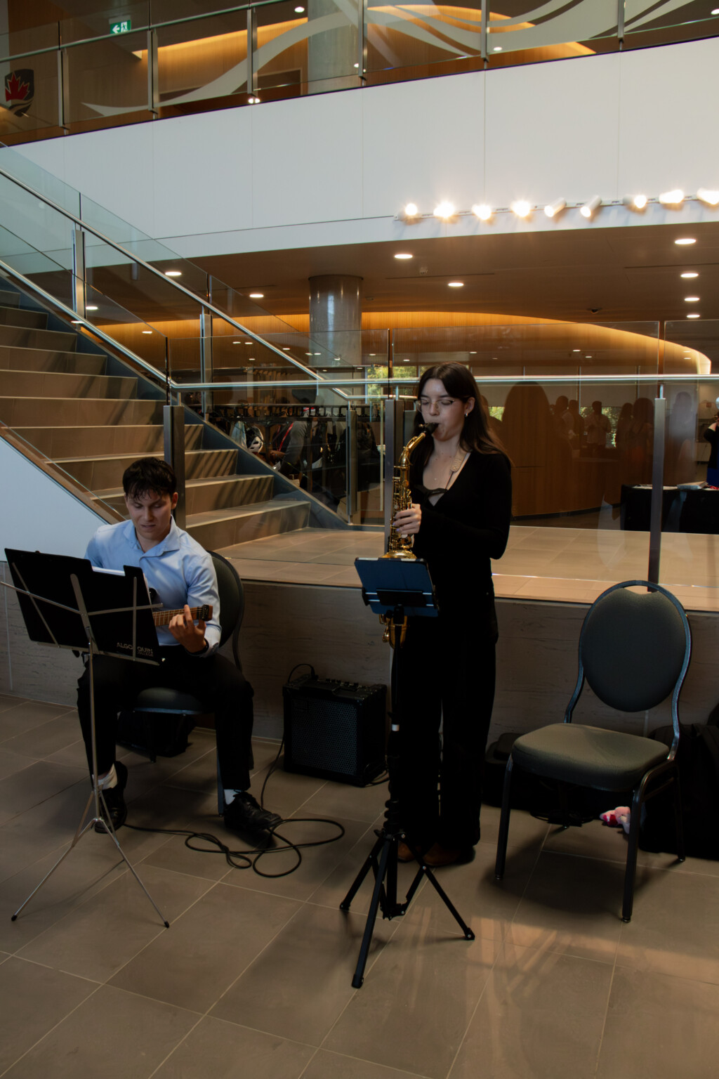 A small musical ensemble performs during the Alumni Reception.
