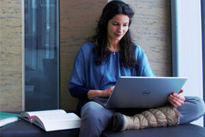 Photo of DPE Student on laptop