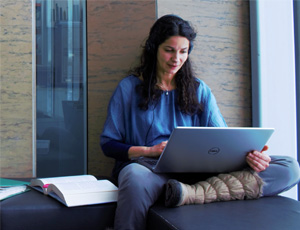 Photo of DPE Student on laptop