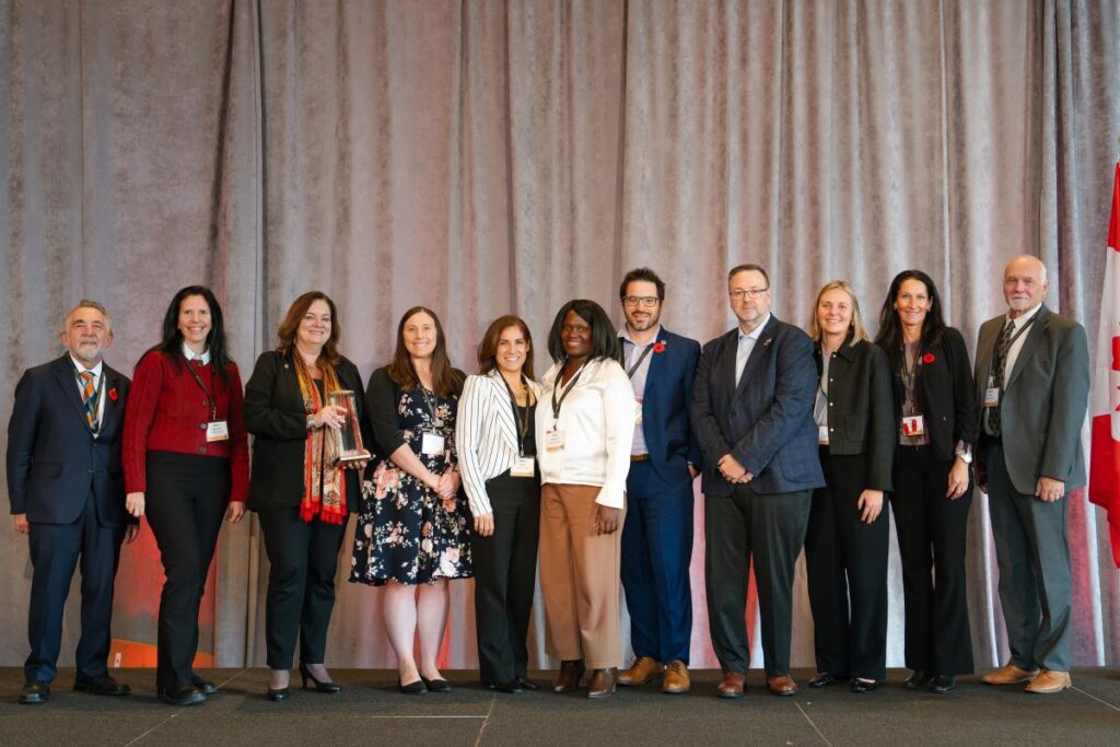 The Students and Enrolment team accepts the Organizational Excellence platinum award in Toronto.