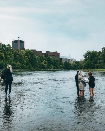 Carleton students collecting data in the Rideau river 