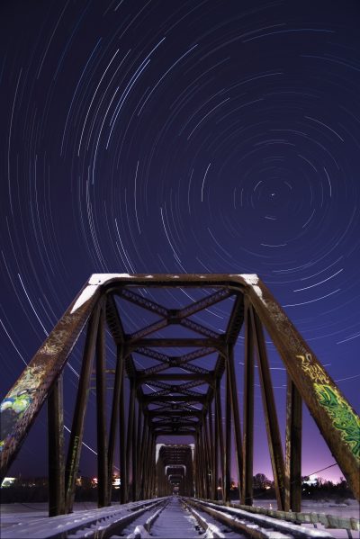 Two hour exposure showing the arcs of the stars as the earth rotates at Ottawa's Prince of Wales Bridge.