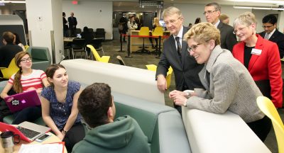 Provincial and municipal delegates speak with Carleton students at the Discovery Centre