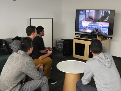 Students playing video games in the Gaming Lab at the Discovery Centre
