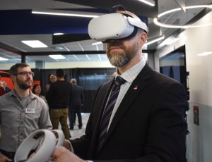 President Benoit-Antoine Bacon participates in a VR demo