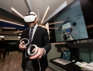 President Benoit-Antoine Bacon participates in a VR demo