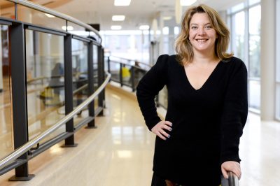 Prof. Anne Trépanier standing in the Tory foyer