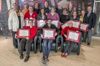 The EDC's CBOT graduates pose for a group shot holding their certificates