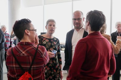 David Hornsby chats with some instructors in the Richcraft Hall conference rooms