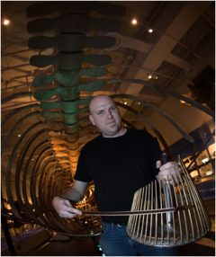 Jesse Stewart rehearses in Blue Whale skeleton at Canadian Museum of Nature for Nocturne performance.