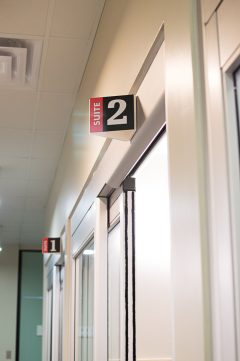 The suite number signs outside the edit suites in the Media Commons