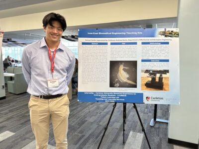 Samuel Smith stands with his project poster