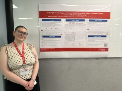 Katelyn Martin stands with her SaPP project poster.