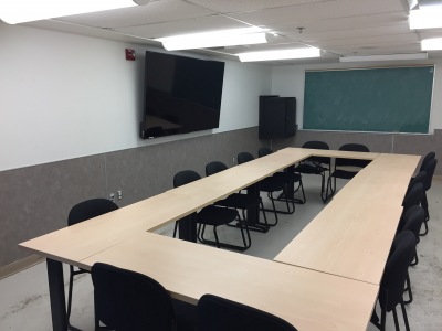 wideshot of meeting room with empty seats