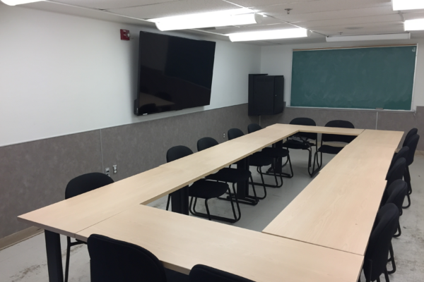 wideshot of meeting room with empty seats