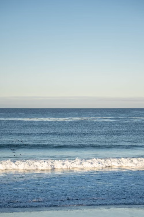 Image of the sea. It's blue and it has waves.