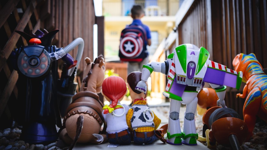 Figurines form Toy Story sadly watching their human head off to school